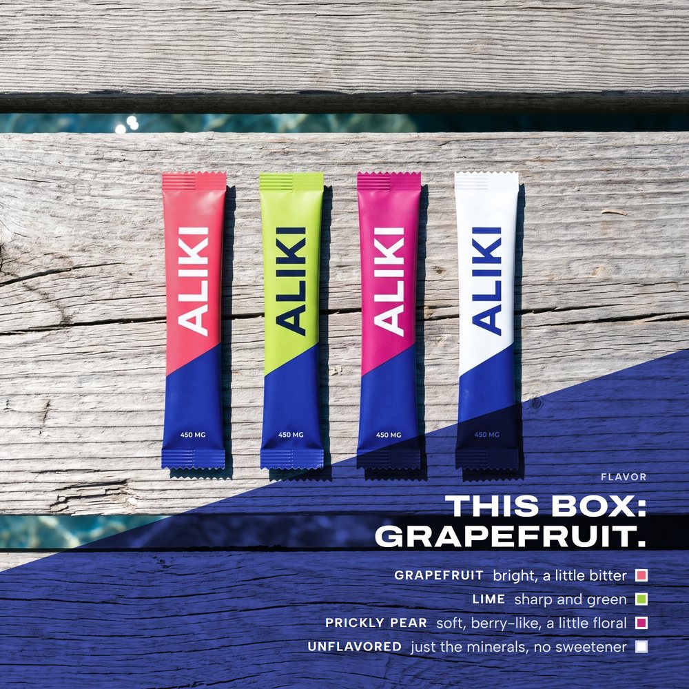 Grapefruit, Lime, Prickly Pear and Unflavored ALIKI sticks on sun-bleached dock planks at noon