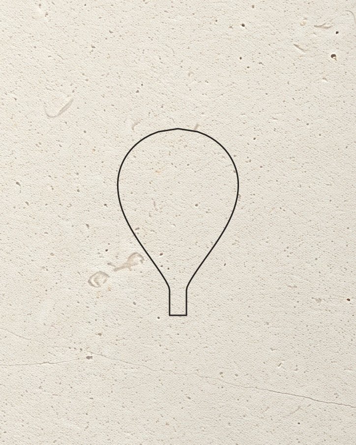 The Corund boule mark drawn as a thin line on pale limestone