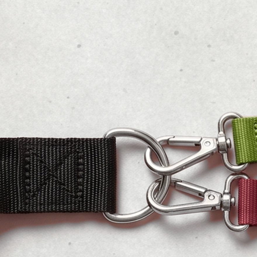 Steel D-ring of an Evenhold handle with a box-X stitch and two clips