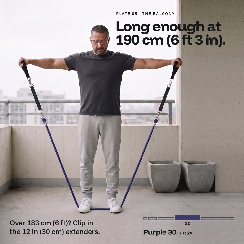 Tall man on a balcony, lateral raise on a purple Evenhold tube, extenders clipped in