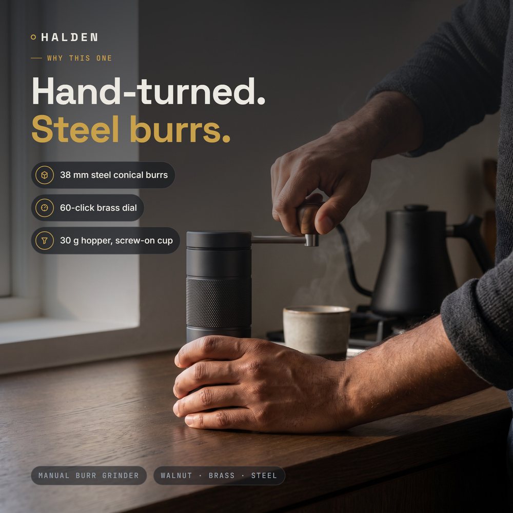 Hands turning the Halden One on a dark oak counter in the morning