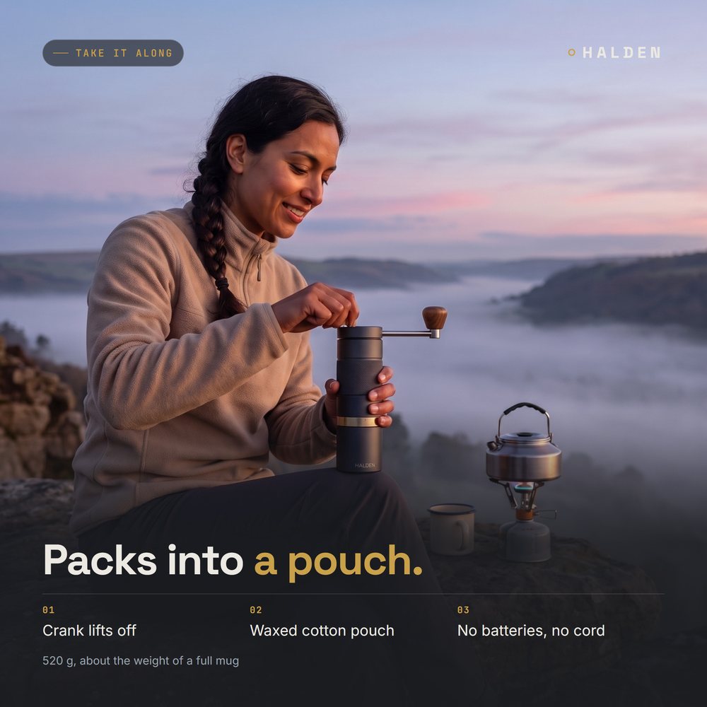 Woman grinding coffee with the Halden One at a dawn campsite by a stove