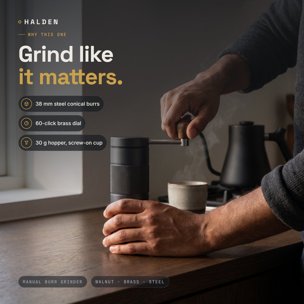 Hands turning the Halden One on a dark oak counter in the morning