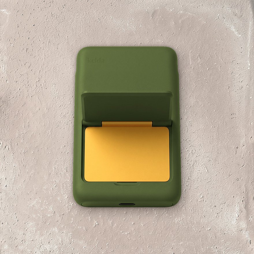 Kelda 37 in Moss, stand open to the marigold inside, on unglazed tile