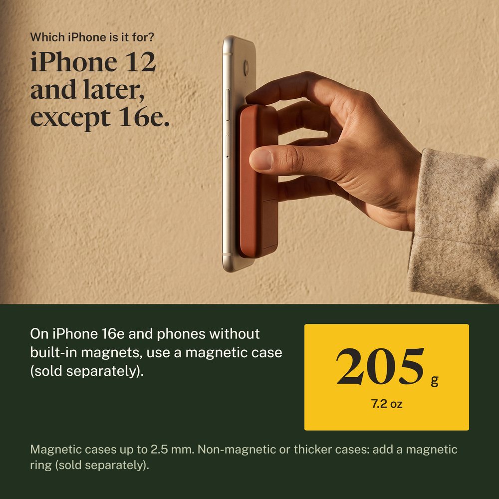 Hand holding the Kelda 37 pack, a phone hanging beside it on the magnets alone
