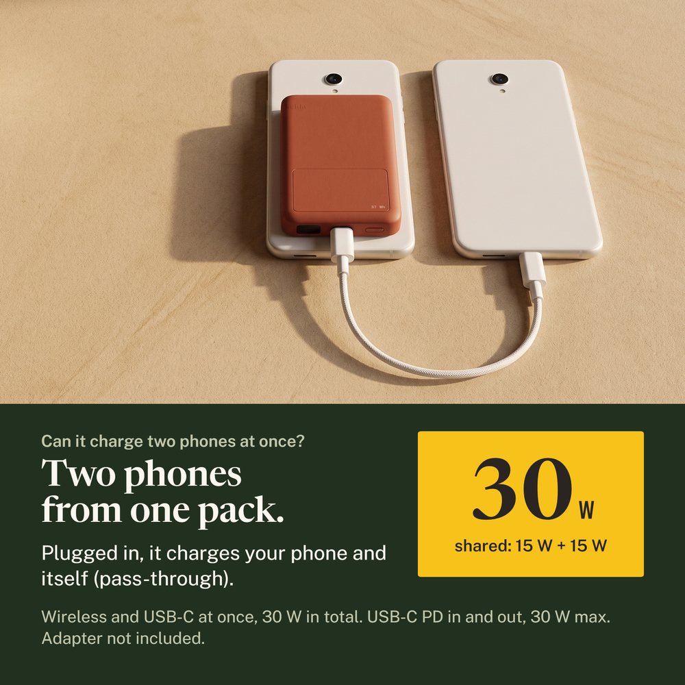 Two phones on sandstone, one with the Kelda 37 pack, a white cable from the pack to the other