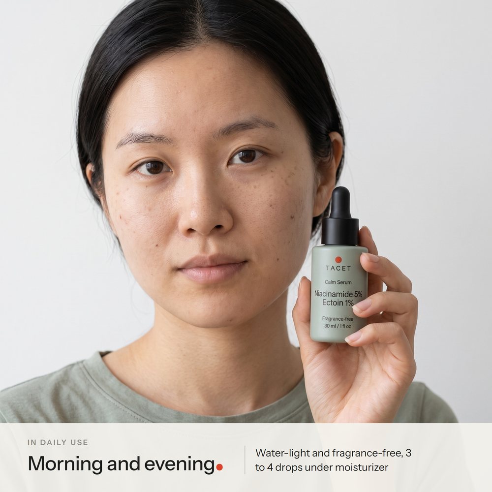 Tacet Calm Serum held beside a woman's cheek, label facing the camera