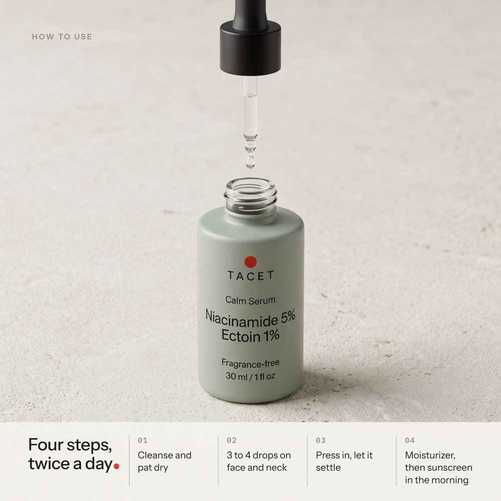Tacet Calm Serum dropper lifted above the open bottle, one drop forming, on pale limestone